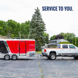 pickup truck pulling a trailer with plumbing equipment